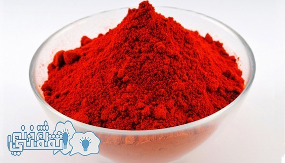 Red paprika powder in a round glass